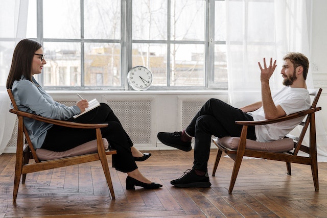a therapist and a male during a session of Individual Therapy